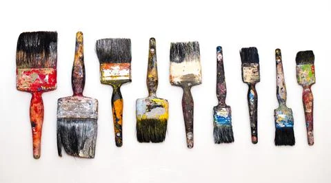 Brushes in paints on a white background Stock Photos