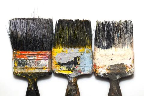 Brushes in paints on a white background Stock-Fotos