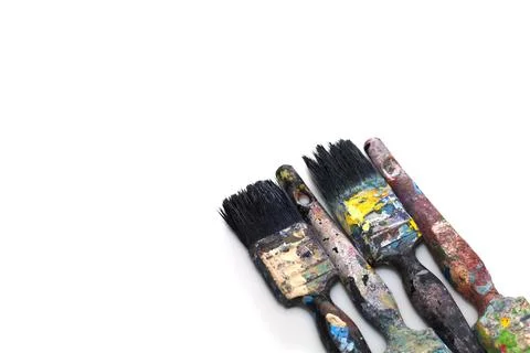 Brushes in paints on a white background Foto stock