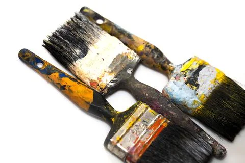 Brushes in paints on a white background Stock Photos