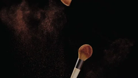 Brushes touch each other on dark background and small particles of confection Video stock 149147833