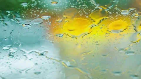 Brushes wipe the water from the windshield of the machine during rain Stock Footage 74542567