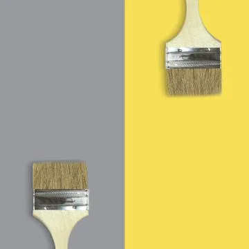 Brushes on a yellow and gray background Stock Photos