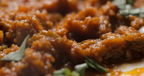 Brushetta tomato preparation rotating with basil pouring slow motion Stock Footage 280519649