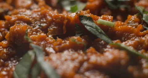 Brushetta tomato preparation rotating with basil pouring slow motion Stock Footage 280519756