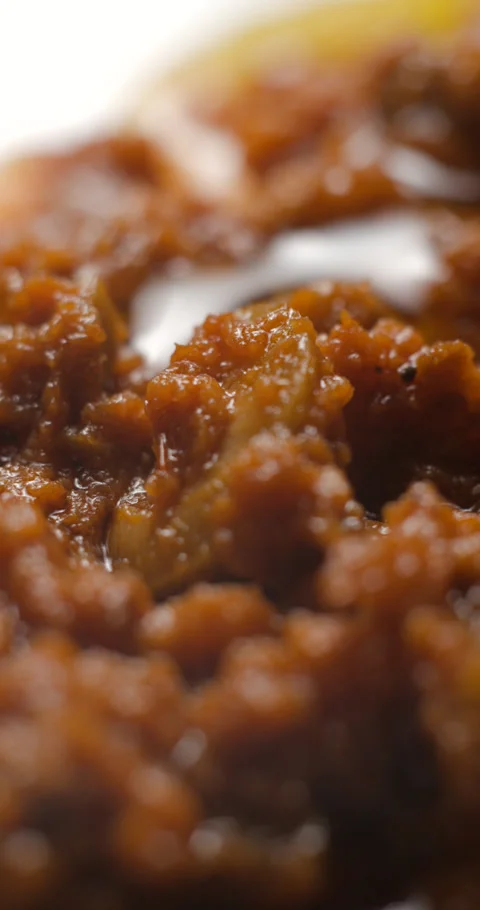 Brushetta tomato preparation rotating with basil pouring slow motion Stock Footage 280519840