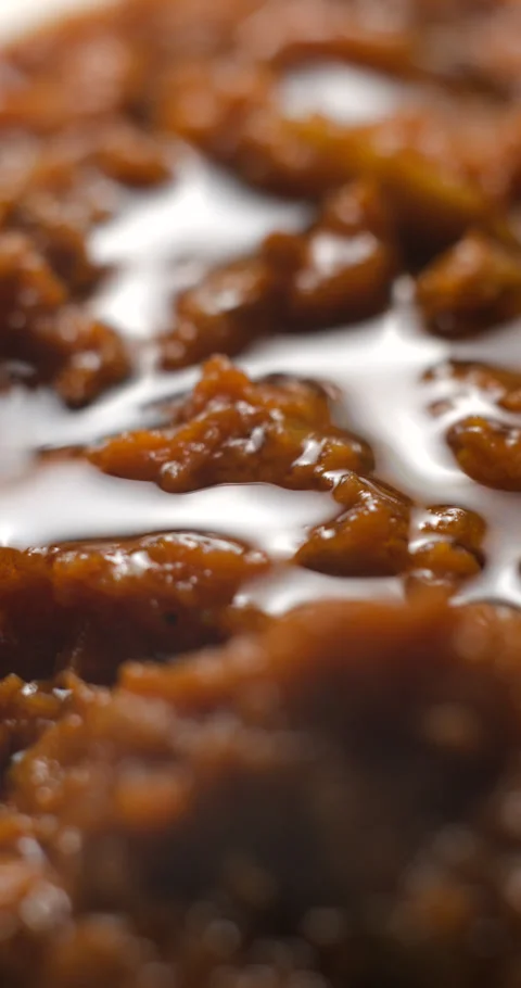 Brushetta tomato preparation rotating with basil pouring slow motion Stock Footage 280519896