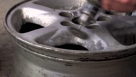 Brushing an alloy wheel 4K Video stock 196735309