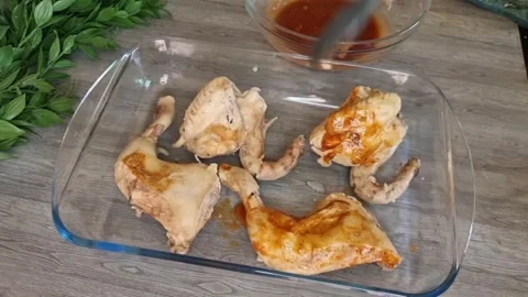 Brushing BBQ Sauce on Chicken Pieces | Marinating Chicken Stock Footage 345489133