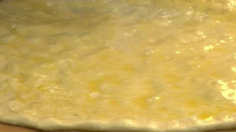 Brushing dough with oil Stock Footage 8572828