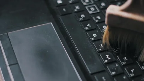 Brushing Dust Off Laptop Touchpad And Keyboard Stock Footage 319482364
