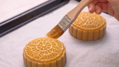 Brushing egg liquid on pastry surface before baking. Festive homemade concept. Stock Footage 114052187