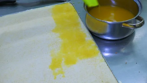 Brushing Egg Wash onto Pastry Dough by Hand Stock-Footage 345047689