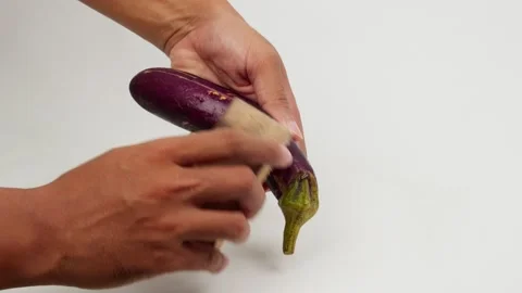 Brushing Eggplant Clean by Hand Video stock 327848829