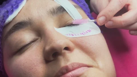 Brushing Eyelashes During Extension Procedure Stock Footage 337550666