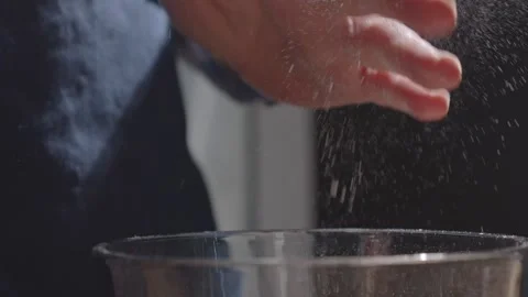 Brushing flour off hands slow motion Stock Footage 149944937