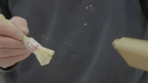 Brushing glue onto wood ends Stock Footage 163413740