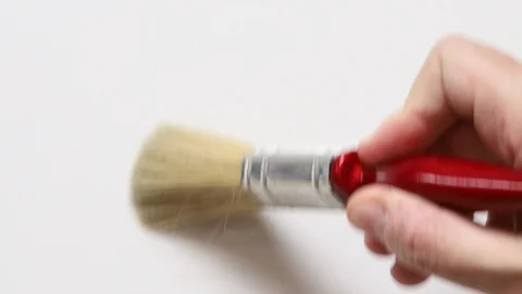 Brushing movement hand paint white background Stock Footage 125420137