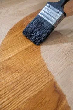 Brushing Oil onto Oak Surface Stock Photos