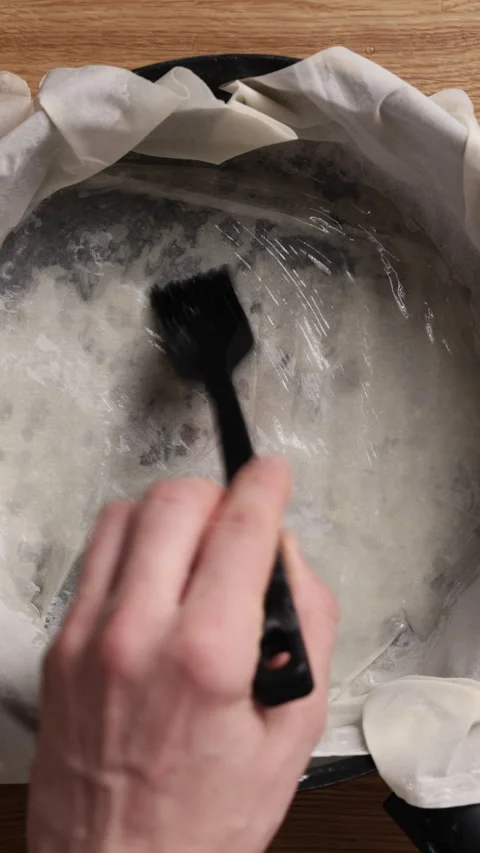 Brushing Phyllo Dough With Olive Oil Top View Vertical Vidéo 337289816