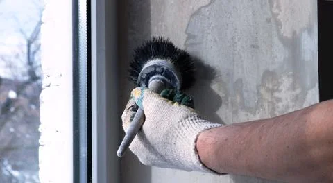 Brushing the primer on the window slope Stock Photos