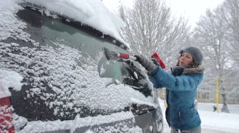 Brushing Snow Off The Back Windshield Of The Car Stock Footage 45392024