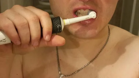 Brushing teeth with an electric toothbrush Stock-Footage 175086682