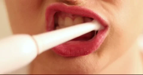 Brushing Teeth with a Paste and Tooth Brush a Close up Shot of Woman Lips. 库存影片 300365304
