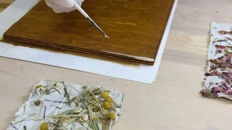 Brushing wood panel for decorative craft with handmade floral paper. Eco-friendl 스톡 동영상 313518788