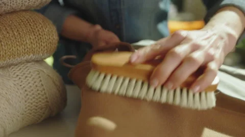 Brushing a Wool Coat for Lint Removal and Maintenance Stock Footage 332450328