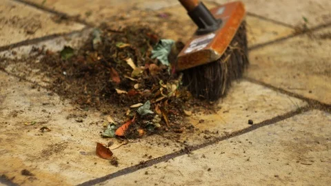 Brushing the yard Stock Footage 94720271