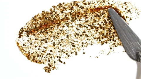 Brushstrokes of gold paint brush applied isolated on a white background. Gold 스톡 동영상 201592502