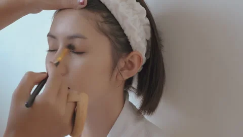 Brusing up eye then smile to camera Stock Footage 265863116