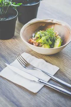 Brussel Sprouts with Bacon Bits served in a bowl on a table Stock Photos