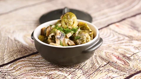 Brussel sprouts stewed in sour cream sauce with mushrooms and spices Stock Footage 293473227