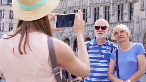 BRUSSELS, BELGIUM- CIRCA August 2017: Daughter taking photo of her senior Video stock 84113228