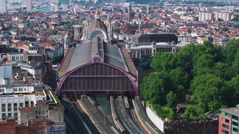 Brussels skyline emerges as clouds drift across the cityscape, showcasing iconic Vídeos de archivo 302180790