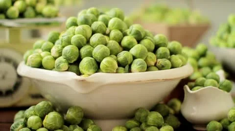 Brussels sprouts in assorted pots and dishes (section) Stock Footage 24673429