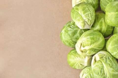 Brussels sprouts on the background of paper packaging, close-up. Eco-friendly Stock Photos