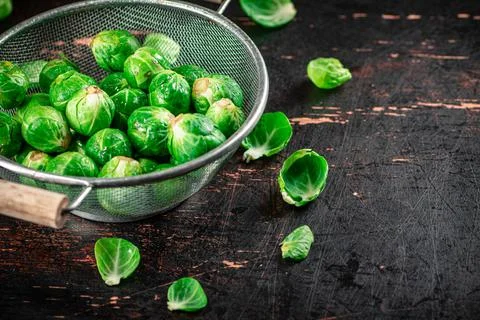 Brussels sprouts in a colander. Stock Photos