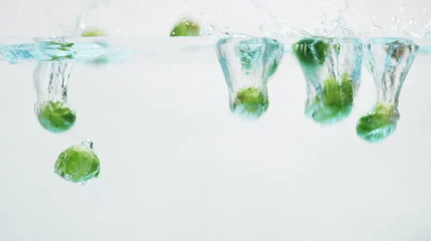 Brussels Sprouts Falling into Water Stock Footage 67889458