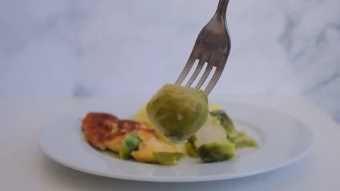 Brussels sprouts on a fork Stock Footage 285425016