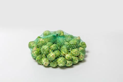 Brussels sprouts in a net Stock Photos