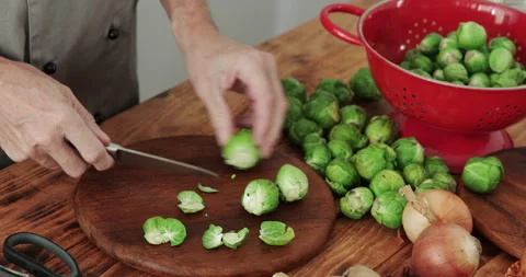 Brussels sprouts peeling close up Stock Footage 305003215