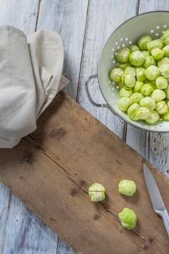 Brussels sprouts in a sieve on a table Stock Photos