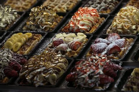 Brussels' Sweet Symphony: Assorted Belgian Waffles Topped with Fruits Stock Photos