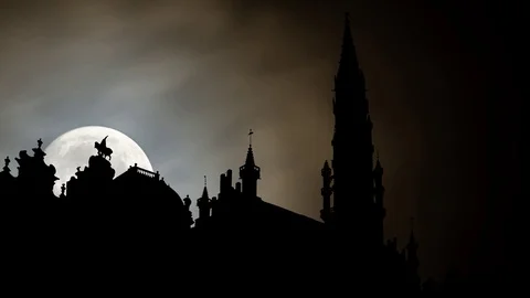 Brussels: The Town Hall or Hotel de Ville in silhouette by Night with Full Moon Stock Footage 104378878
