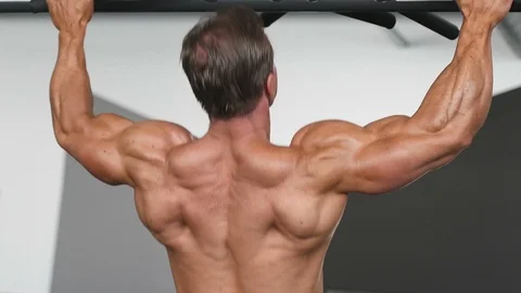 Brutal aged strong bodybuilder athletic men pumping up muscles with dumbbells Video stock 90951348
