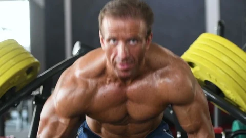 Brutal aged strong bodybuilder athletic men pumping up muscles with dumbbells Video stock 90952570