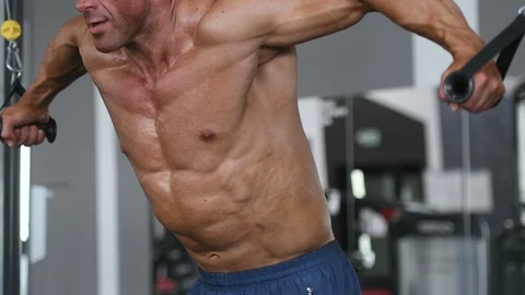 Brutal aged strong bodybuilder athletic men pumping up muscles with dumbbells Video stock 90967474